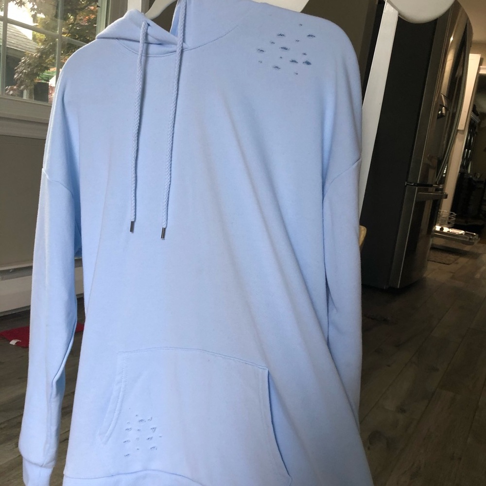 Sweatshirt with small rips